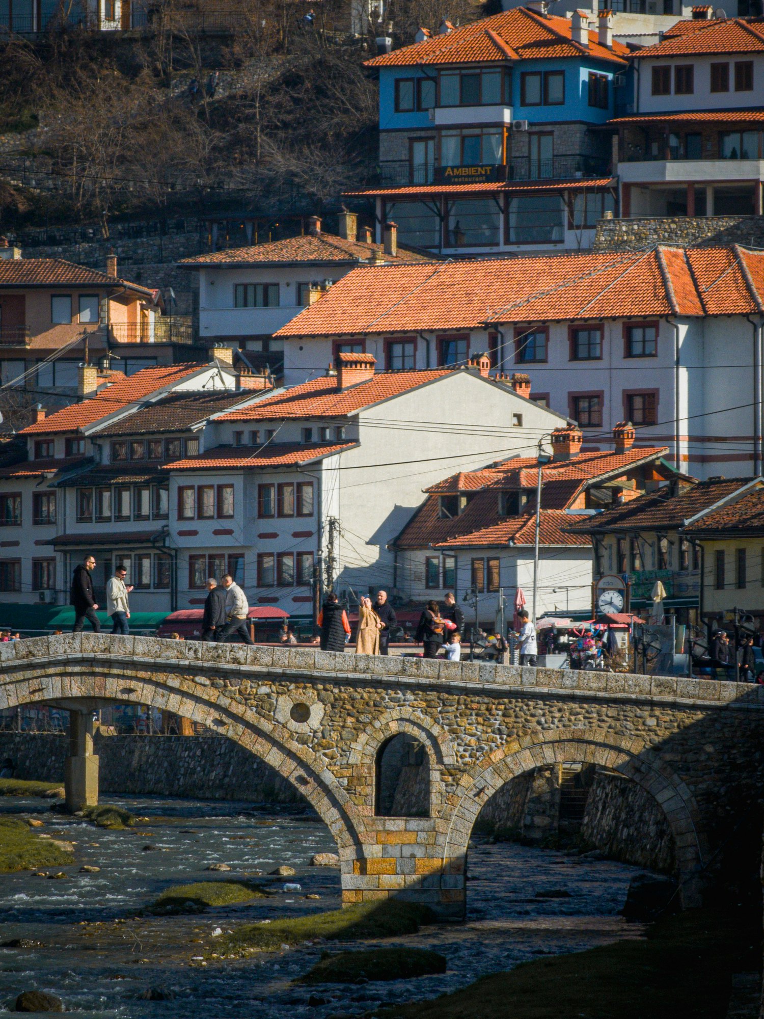 Scenic view of a crowd on a river flowing through quaint town of Prizren, Kosovo