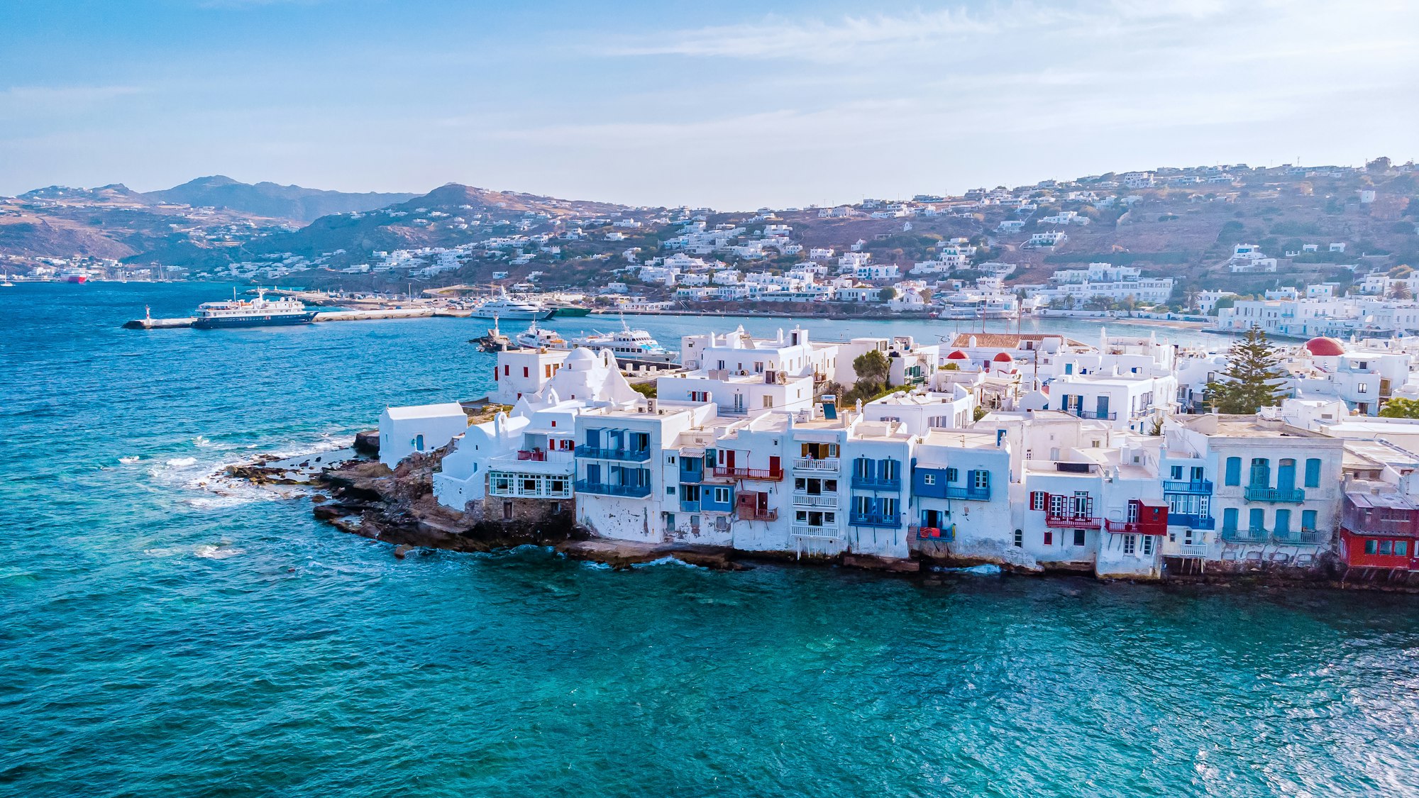 Mykonos Greece , colorful streets of the old town of Mykonos with tourist in the street